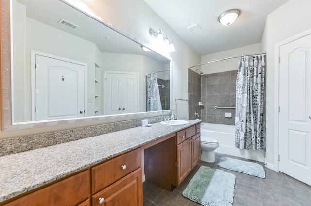 full bathroom featuring vanity, toilet, shower / bath combination with curtain, and tile patterned floors