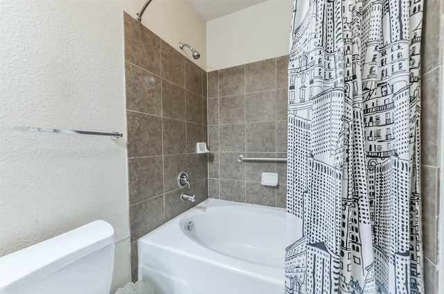 bathroom with toilet and shower / bath combo with shower curtain