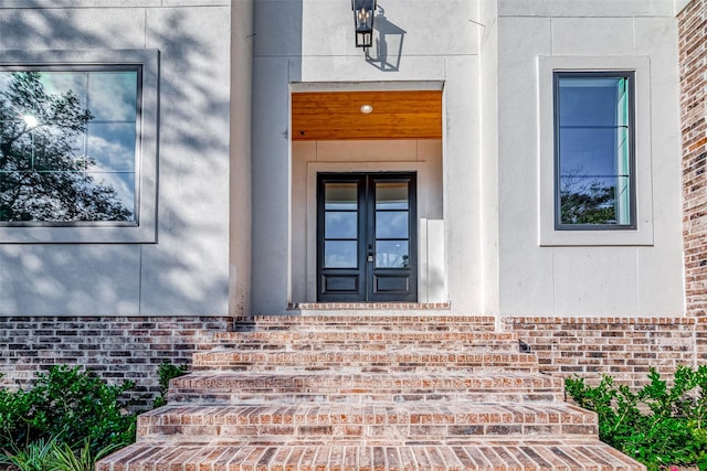 property entrance featuring french doors