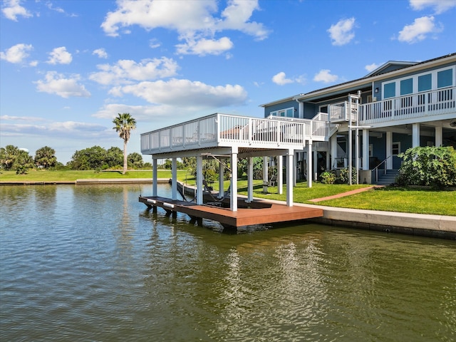 view of dock with a lawn and a deck with water view