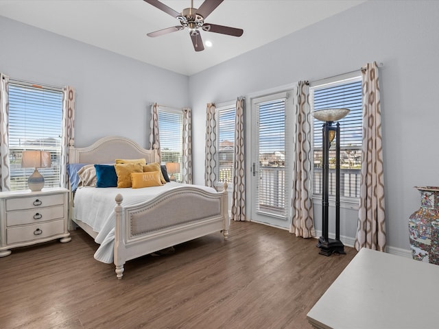 bedroom featuring ceiling fan, dark hardwood / wood-style flooring, and access to outside