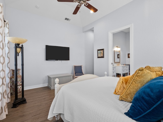 bedroom with ceiling fan, ensuite bathroom, and dark hardwood / wood-style flooring