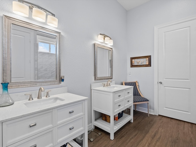 bathroom with vanity and hardwood / wood-style flooring