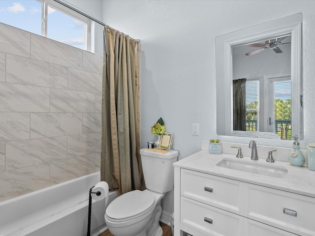 full bathroom with vanity, plenty of natural light, shower / tub combo, and toilet