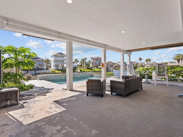 view of patio with a water view