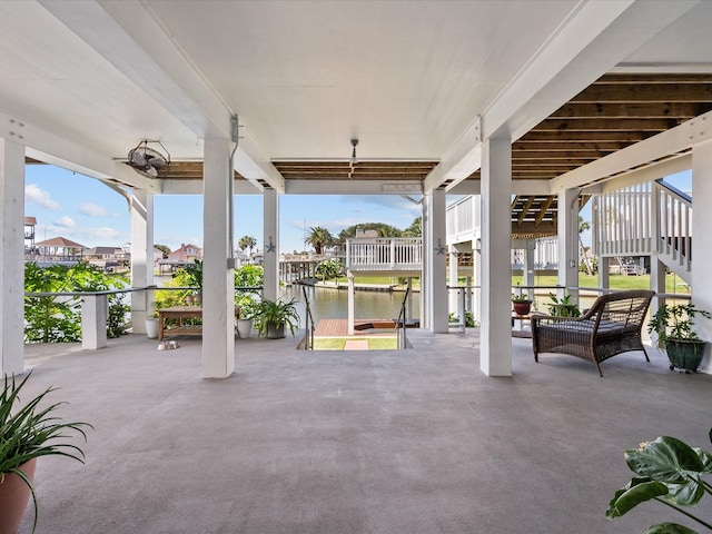 view of patio with a water view