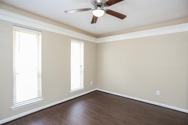 spare room featuring ornamental molding, dark wood-type flooring, and ceiling fan