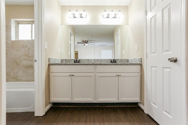 bathroom featuring vanity, ceiling fan, and hardwood / wood-style floors