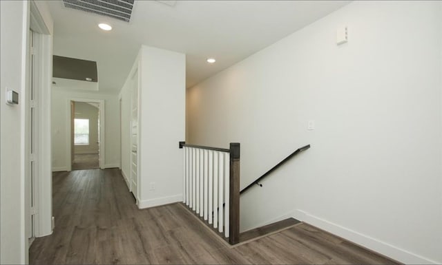 corridor featuring dark hardwood / wood-style flooring