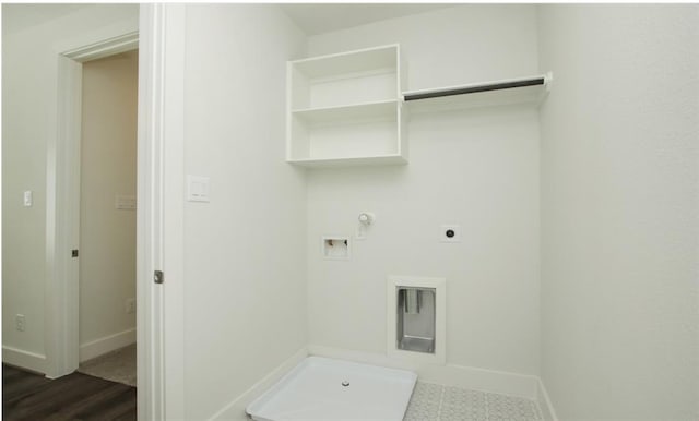 laundry room featuring hookup for an electric dryer, hookup for a washing machine, hookup for a gas dryer, and dark tile patterned flooring