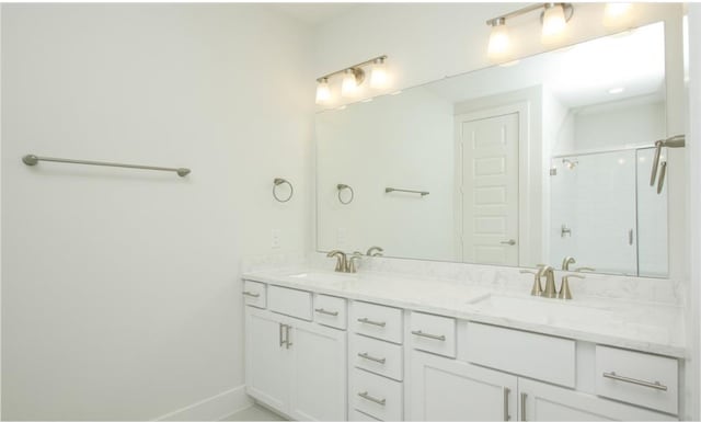 bathroom with vanity and an enclosed shower