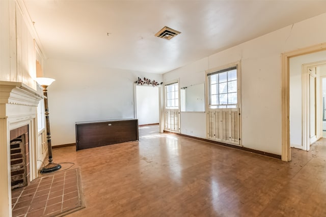 unfurnished living room featuring a fireplace