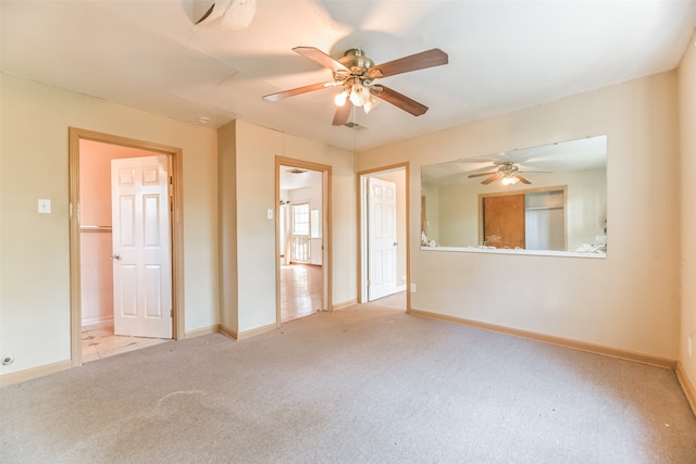 unfurnished room with light carpet and ceiling fan