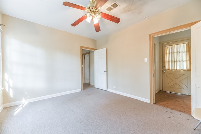 unfurnished room with light carpet and ceiling fan