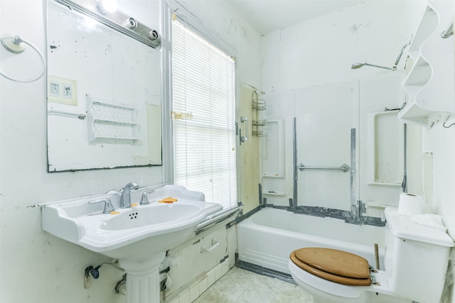 bathroom featuring shower / tub combination and toilet