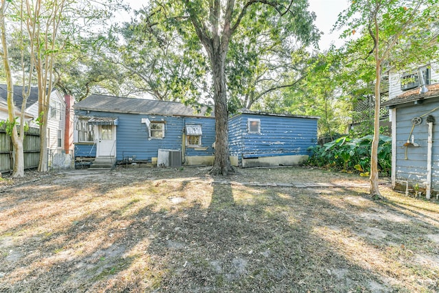 back of house featuring central AC