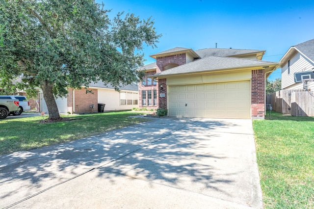 view of front of house with a front lawn and a garage