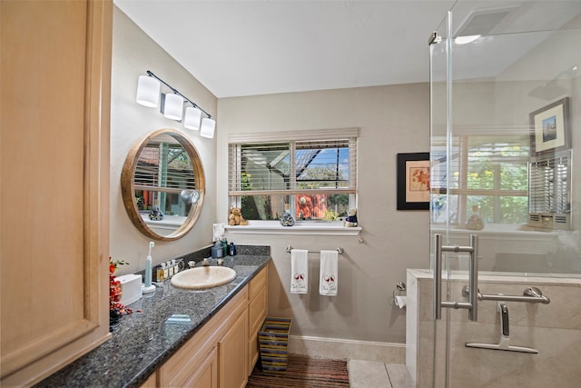 bathroom with tile patterned floors and vanity