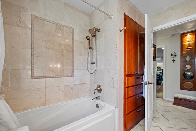 bathroom with shower / bath combo with shower curtain and tile patterned floors