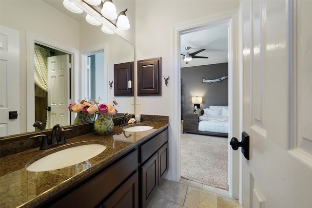 bathroom featuring vanity, ceiling fan, and lofted ceiling