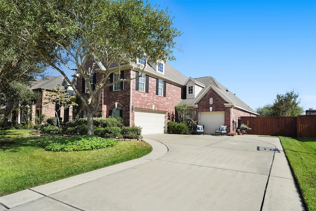 view of front of house with a front yard and a garage