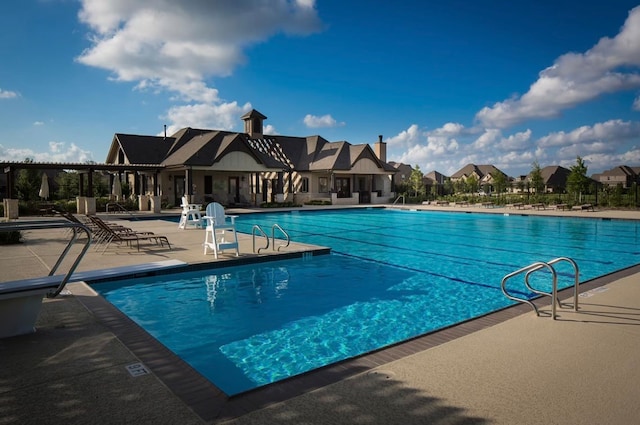 view of pool featuring a patio