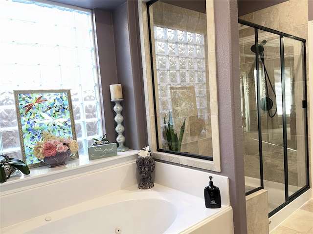 bathroom with plus walk in shower and tile patterned flooring