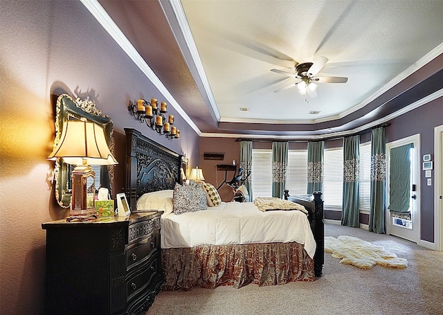 carpeted bedroom with ornamental molding, a raised ceiling, and ceiling fan