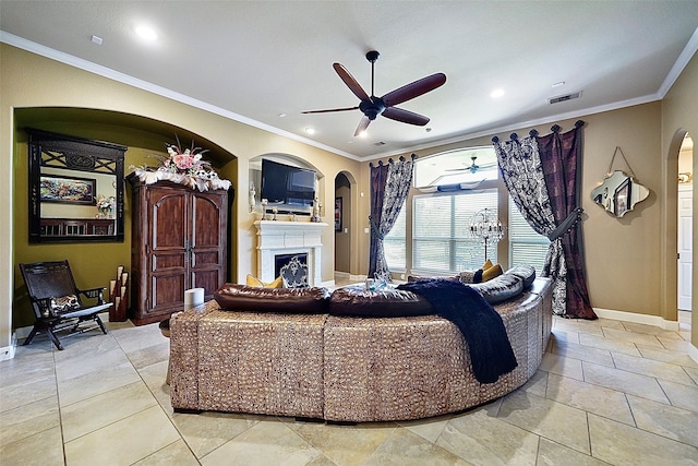 living room featuring ornamental molding, ceiling fan, and light tile patterned floors