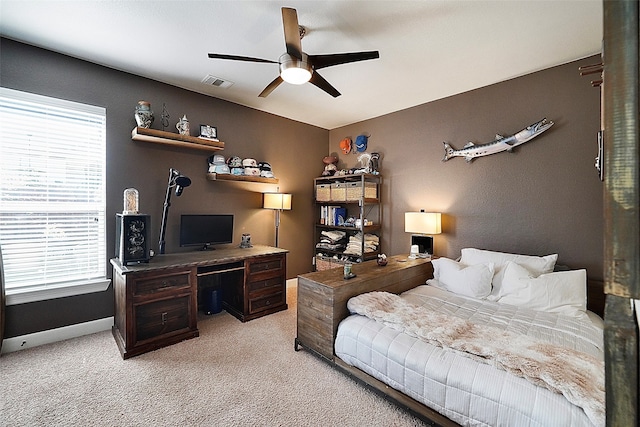 carpeted bedroom with ceiling fan