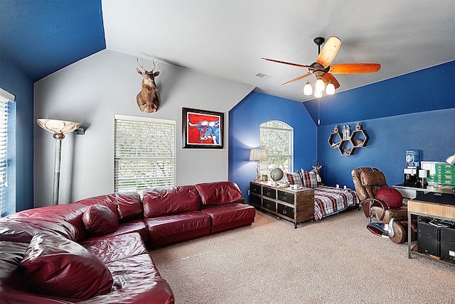 carpeted bedroom featuring ceiling fan and vaulted ceiling