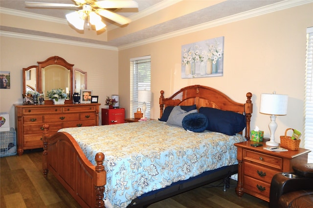 bedroom featuring ceiling fan, ornamental molding, and dark wood-type flooring