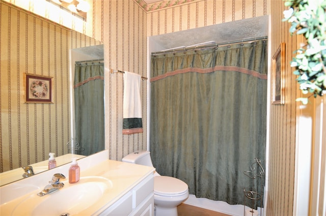 full bathroom featuring shower / bath combination with curtain, vanity, and toilet