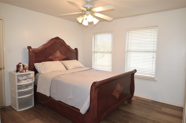 bedroom with ceiling fan and dark hardwood / wood-style floors