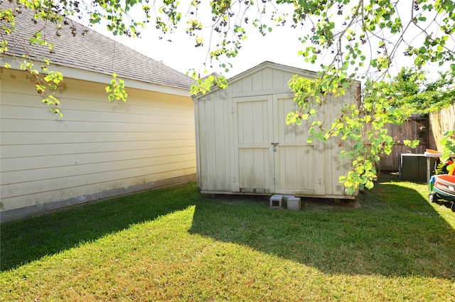 view of outbuilding with a lawn