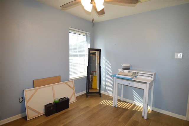 miscellaneous room featuring wood-type flooring and ceiling fan