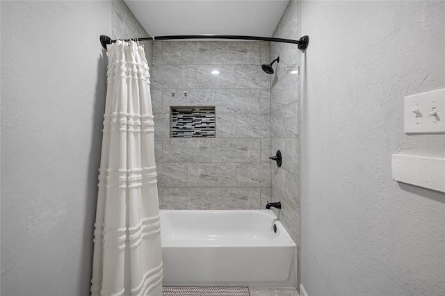 bathroom with shower / bath combo