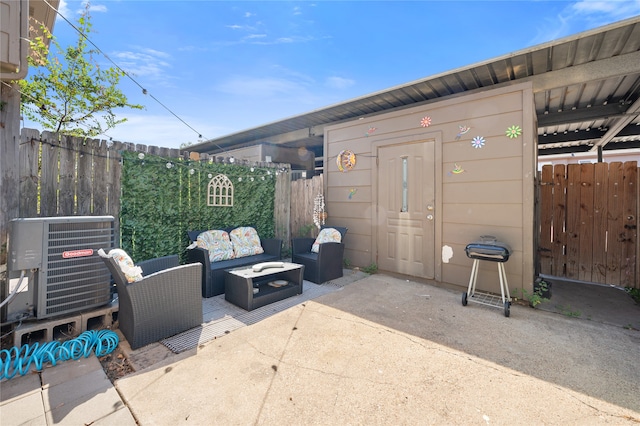 view of patio with cooling unit and an outdoor structure