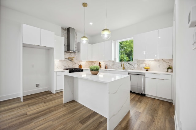 kitchen with dishwasher, wall chimney exhaust hood, and white cabinetry