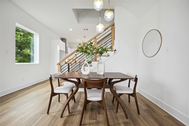 dining area with wood-type flooring