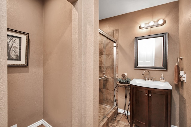 bathroom with vanity and an enclosed shower