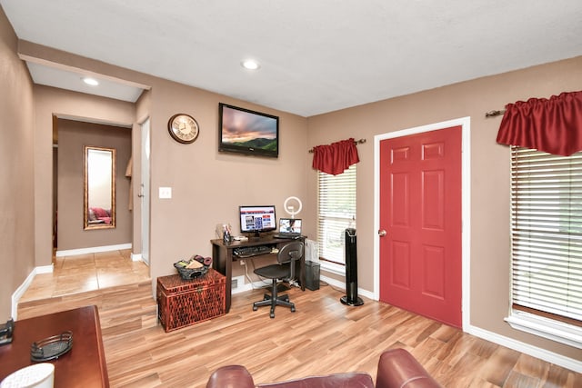 office area with light hardwood / wood-style floors