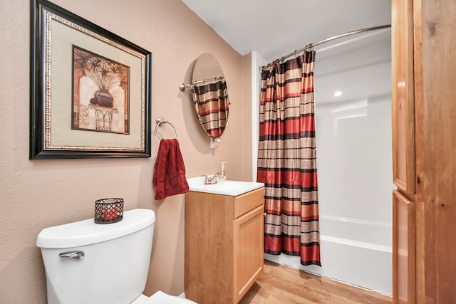 full bathroom with lofted ceiling, shower / bath combination with curtain, hardwood / wood-style flooring, toilet, and vanity