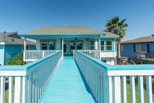 back of property featuring a deck