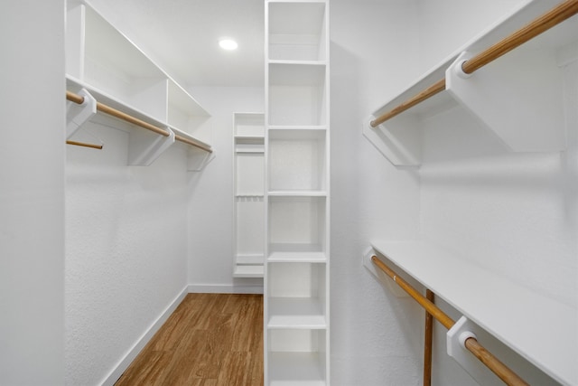 walk in closet featuring hardwood / wood-style flooring