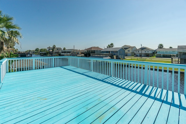 wooden deck featuring a water view