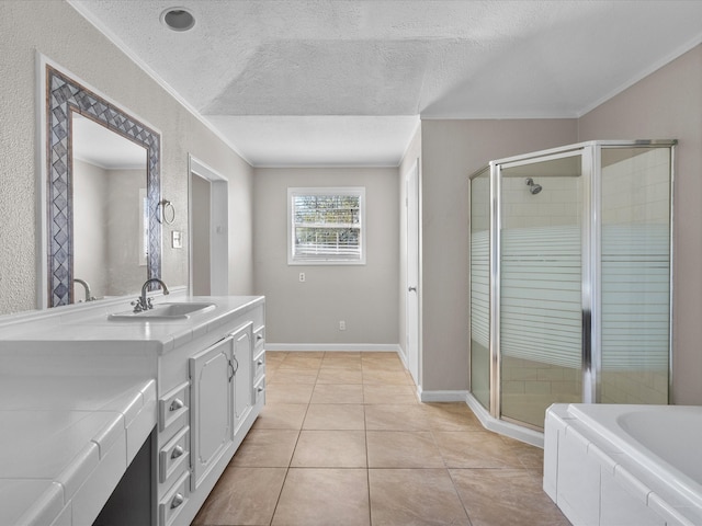 bathroom featuring vanity, ornamental molding, a textured ceiling, tile patterned floors, and shower with separate bathtub