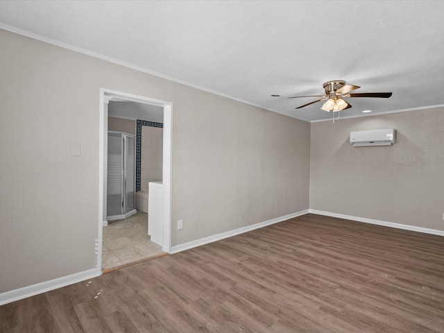 empty room with crown molding, a wall mounted air conditioner, hardwood / wood-style flooring, and ceiling fan