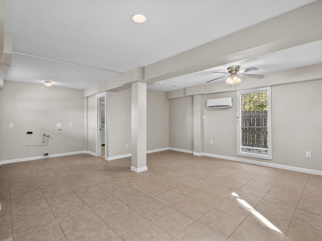 basement with ceiling fan, light tile patterned flooring, and a wall unit AC