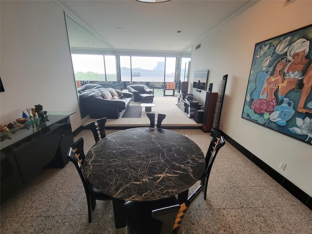 dining area featuring crown molding